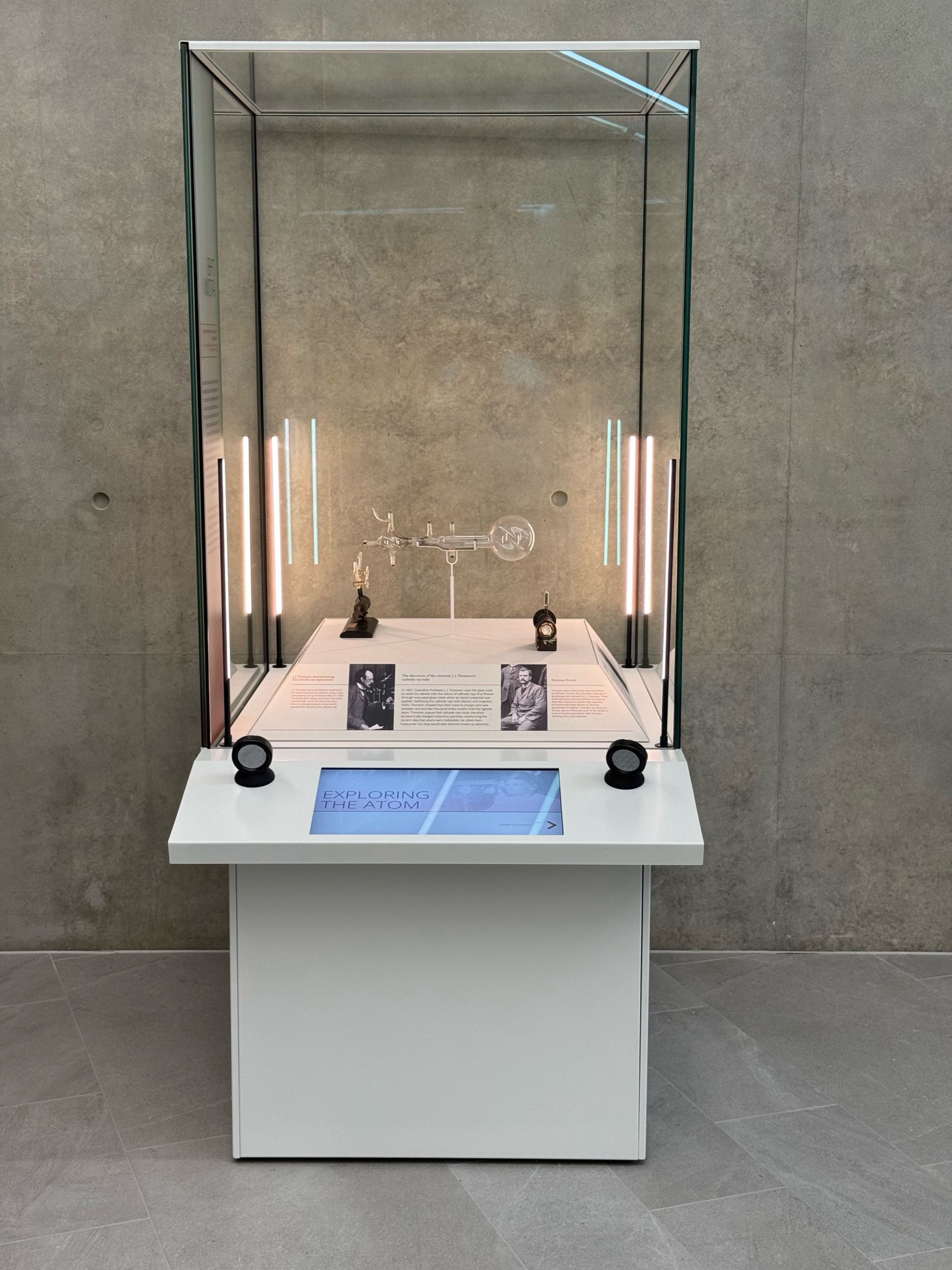 The Atom showcase, containing instruments used in the discovery of the electron, proton and neutron. An interactive touchscreen explores the wider contributions of Cavendish researchers to understanding the structure of the atom.