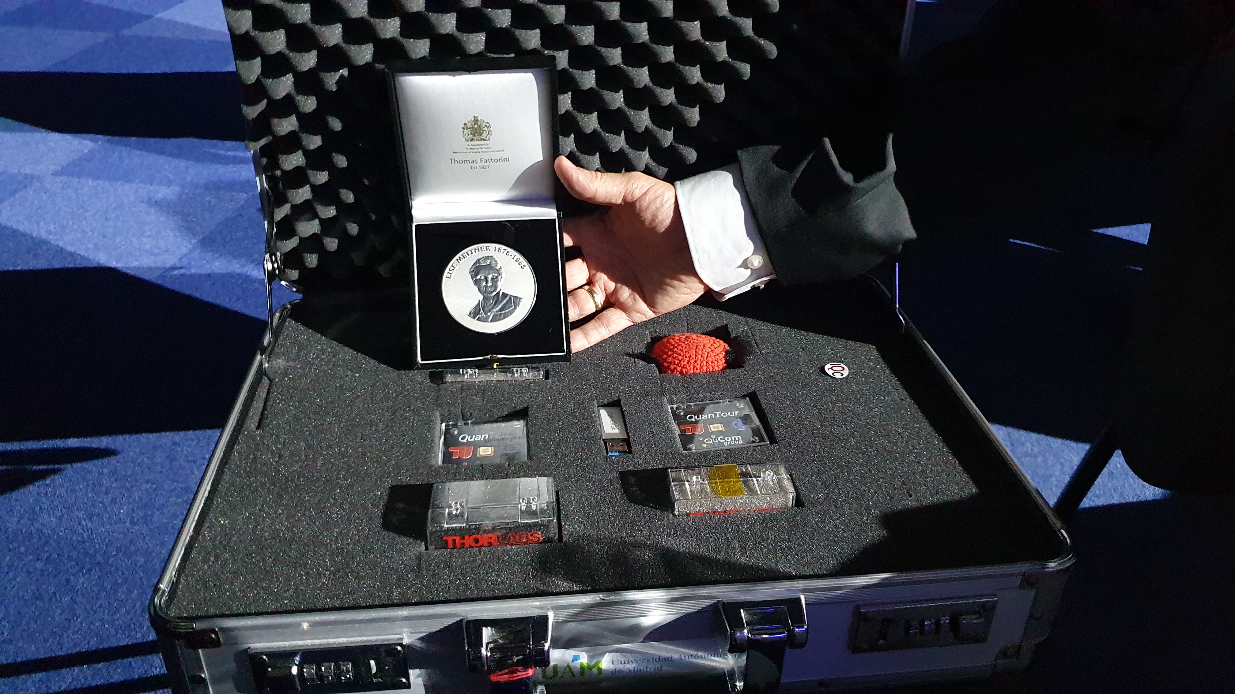 The IOP medal placed beside the quantum light source in a metal case.