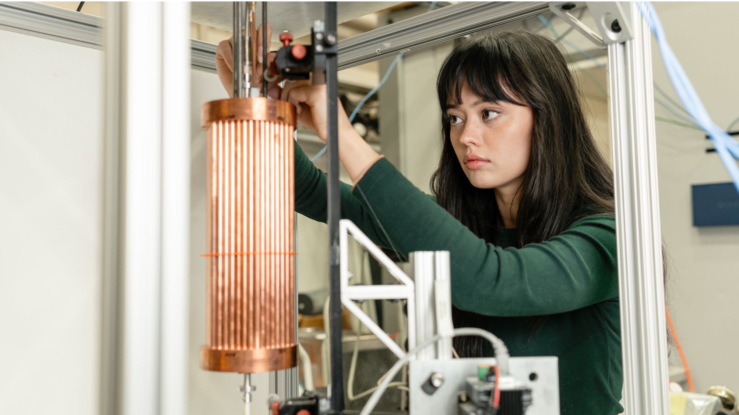 woman manipulating a scientific instrument