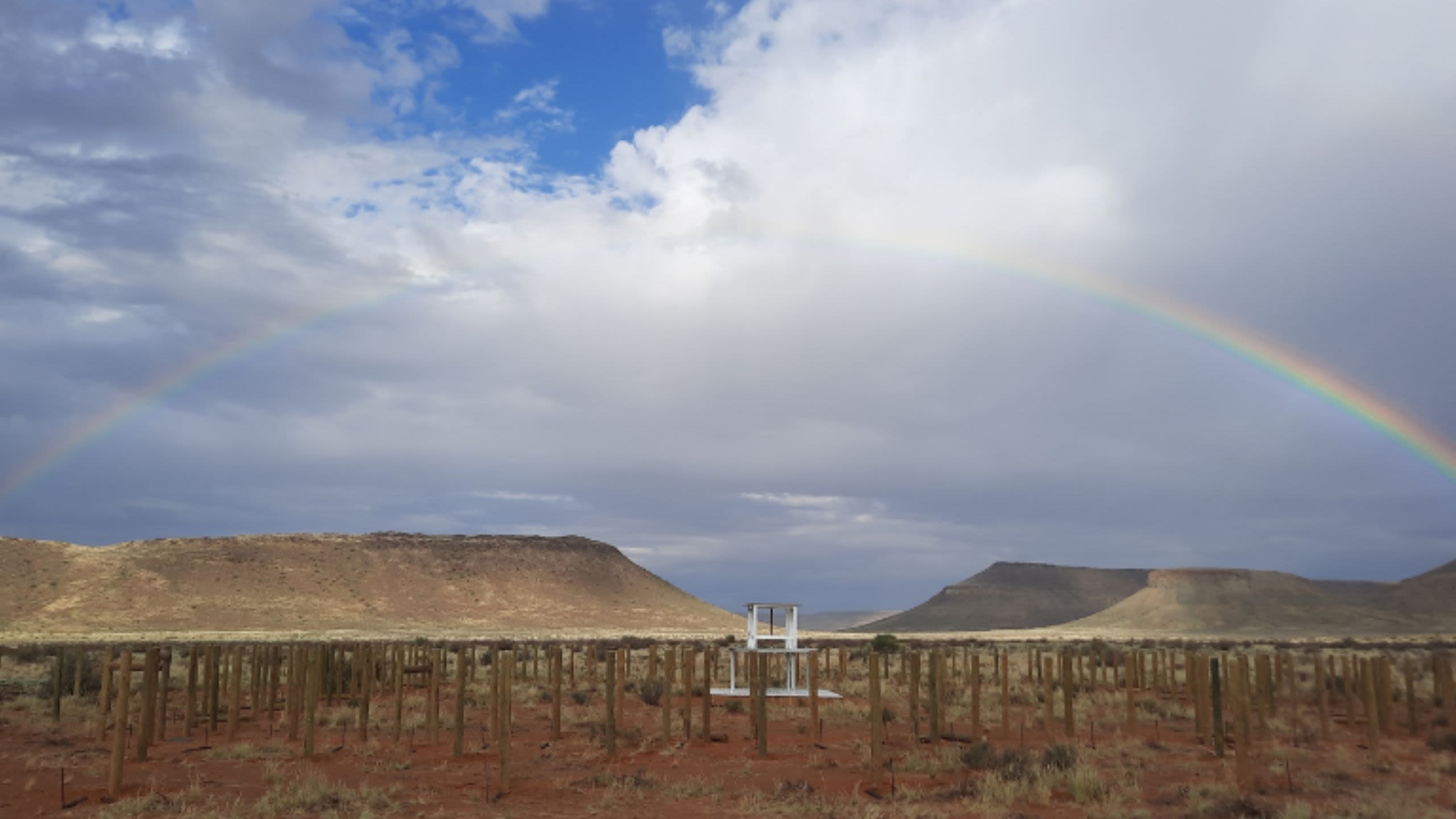 raibow over an instrument in a desert